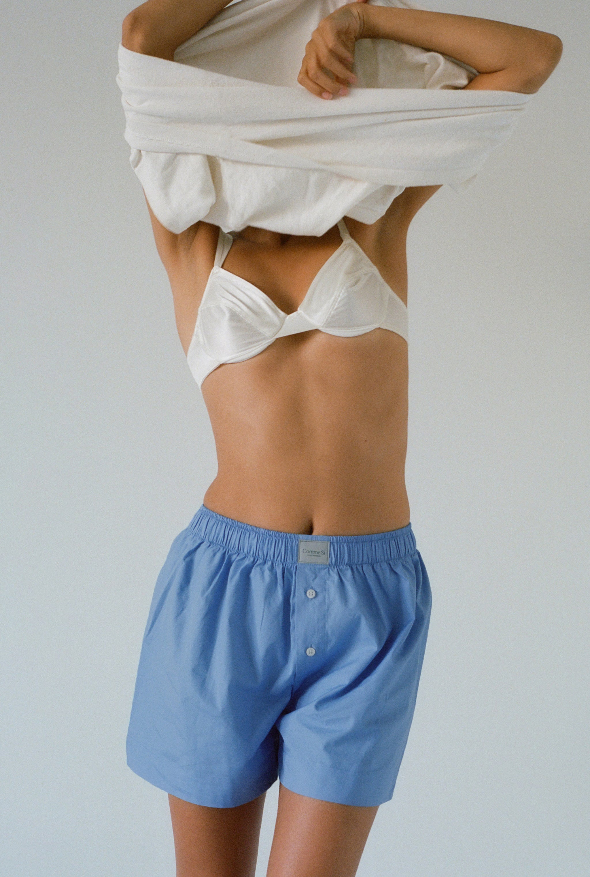 Daniela takes off her white tshirt while wearing La Boxer Classica in Grecian Blue