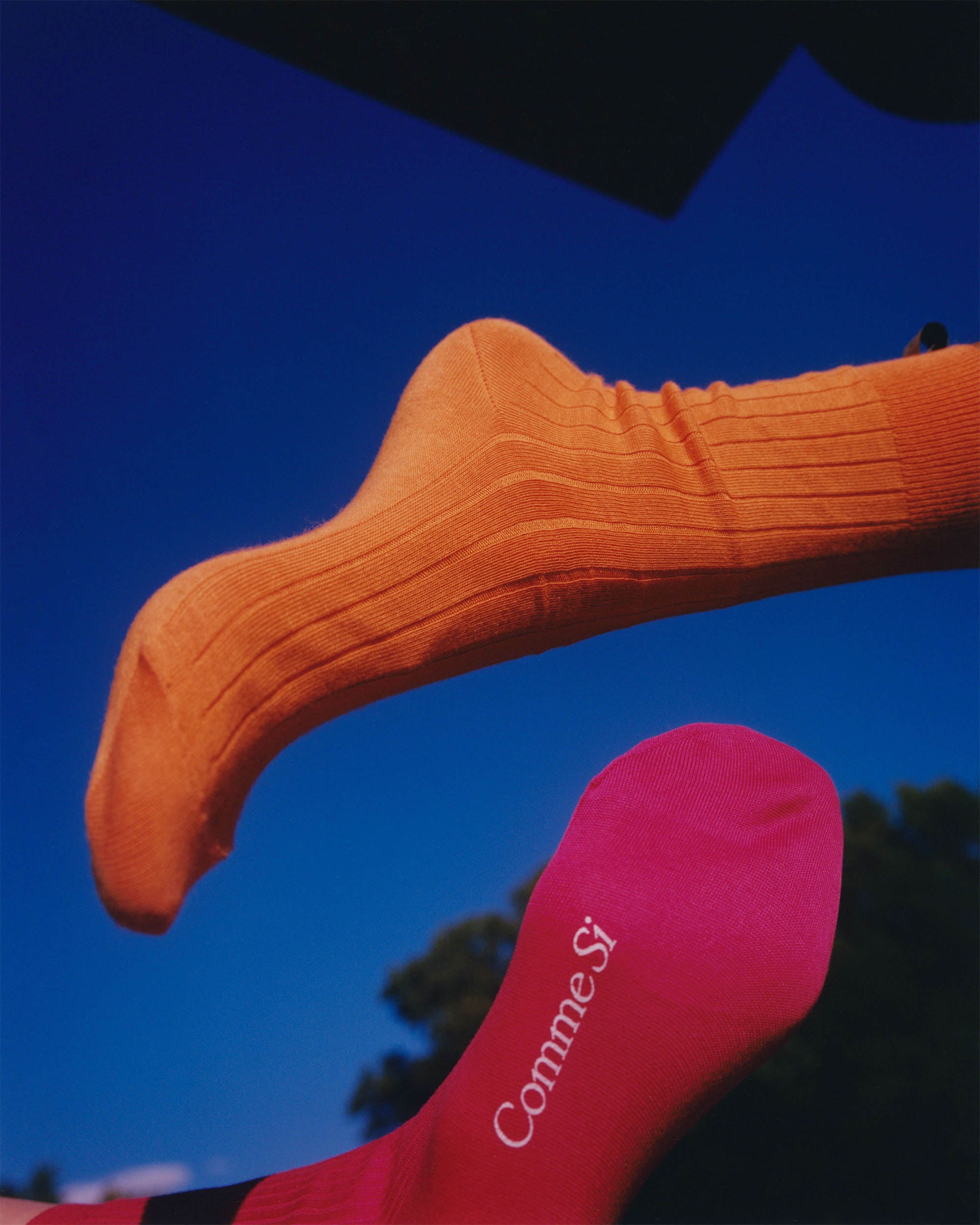 Sunrise, Sunset Campaign by Comme Si, 2021, featuring the Yves sock in Tangerine and Scarlet