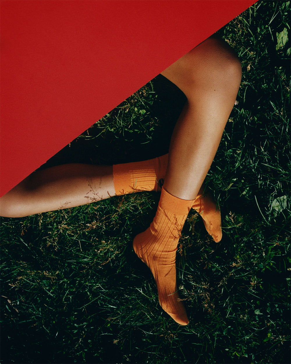 Comme Si Sunrise Sunset campaign photo featuring The Yves Sock in Tangerine, Egyptian cotton sock by Comme Si