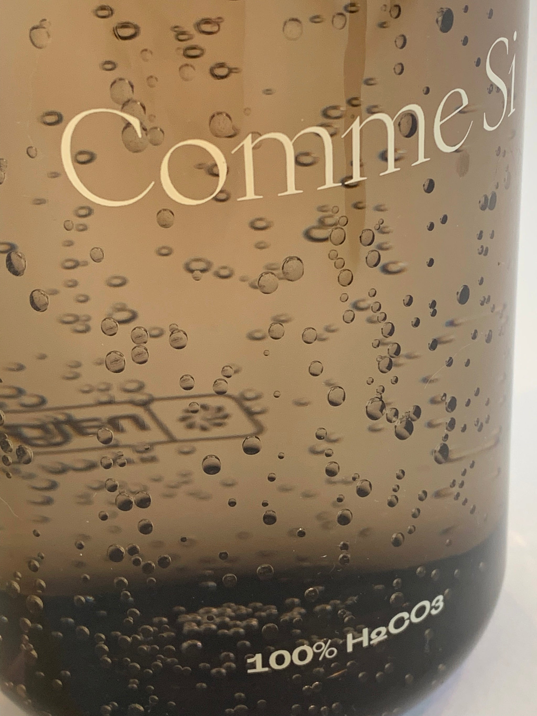 Detail with sparkling water - Dark Charcoal 32oz Nalgene bottle. Comme Si x Nalgene
