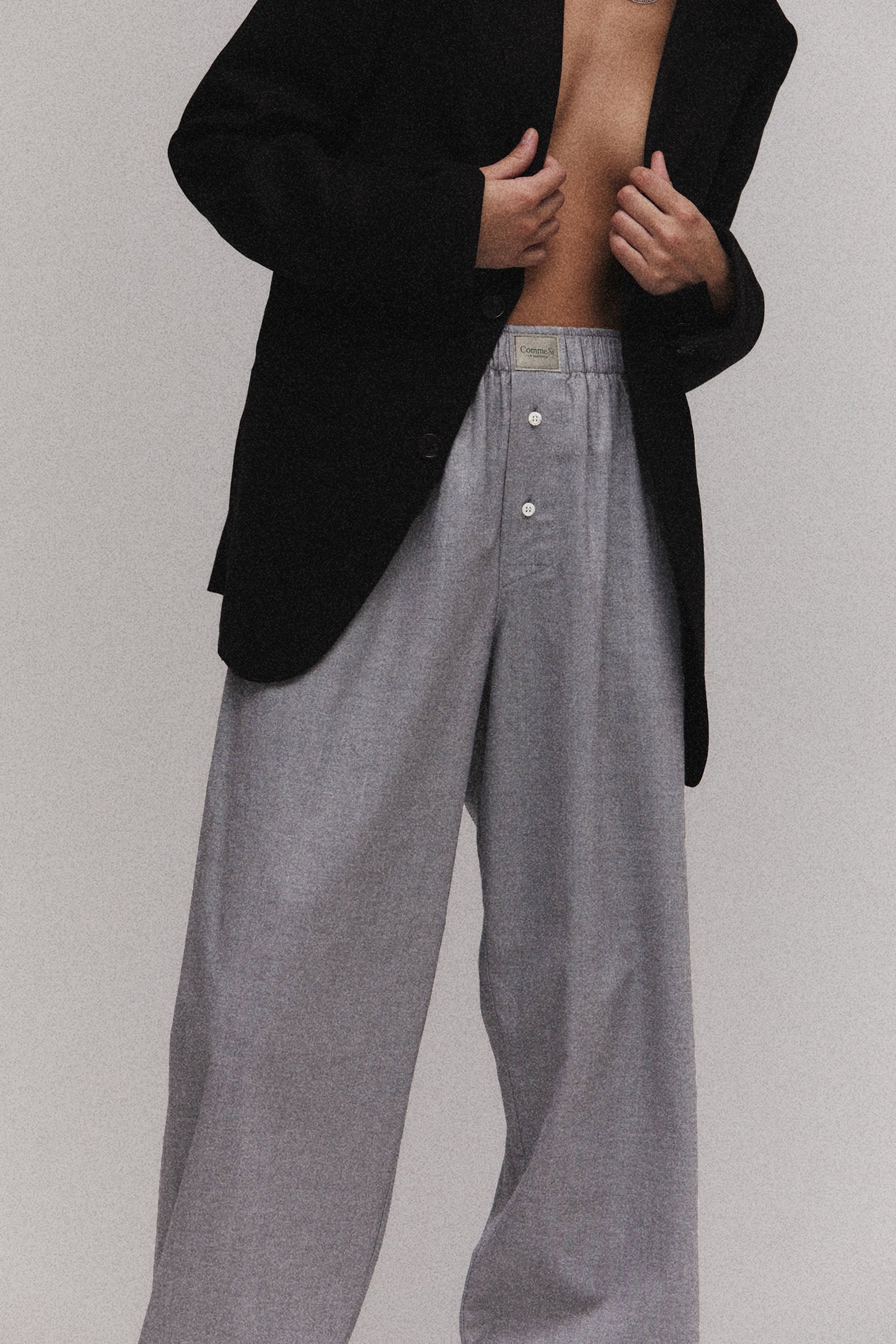Model wears La Boxer Alta in Grey Herringbone, cotton flannel, with a black blazer