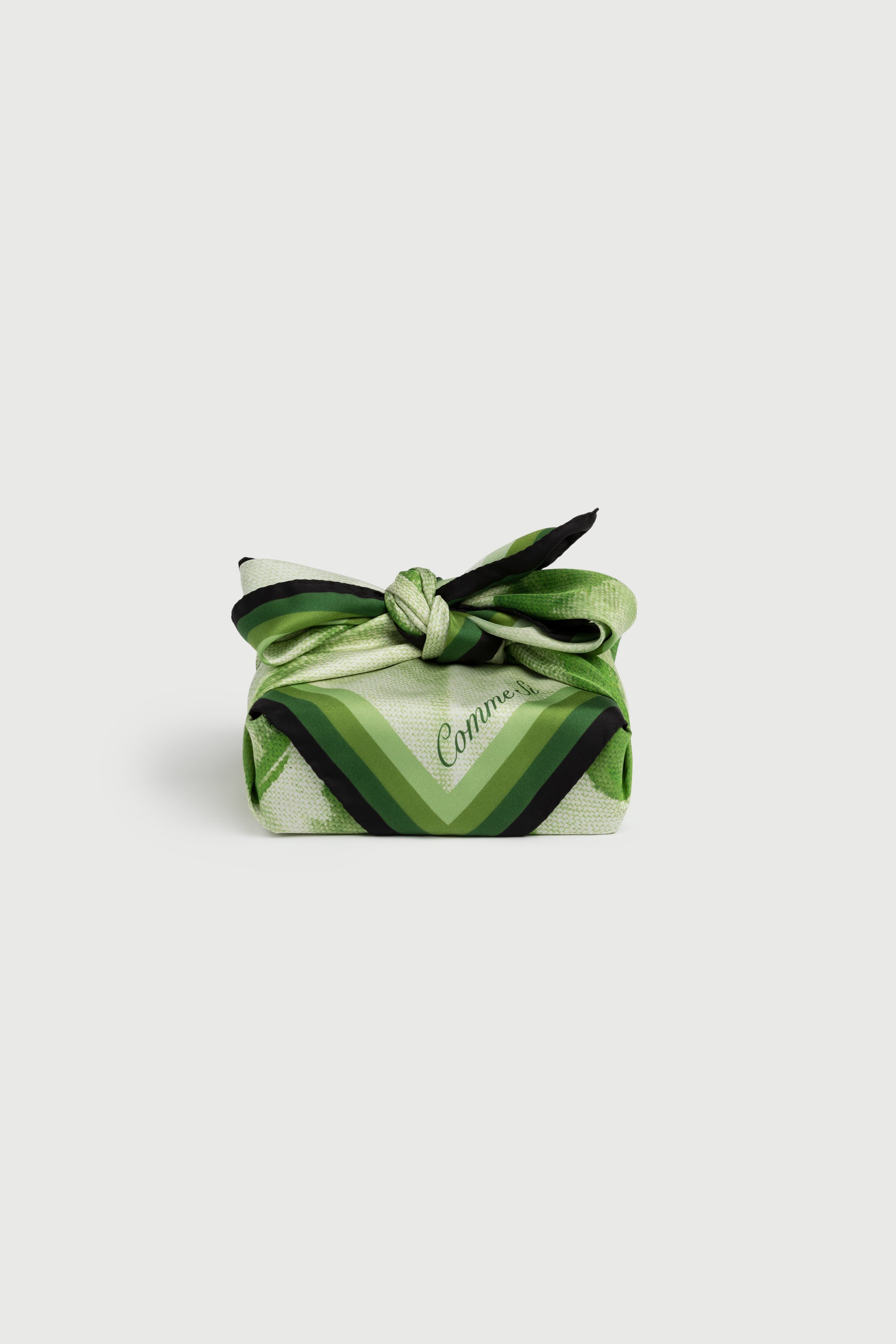 the silk scarf in green, tied as gift wrap, bojagi, comme si, origami pattern