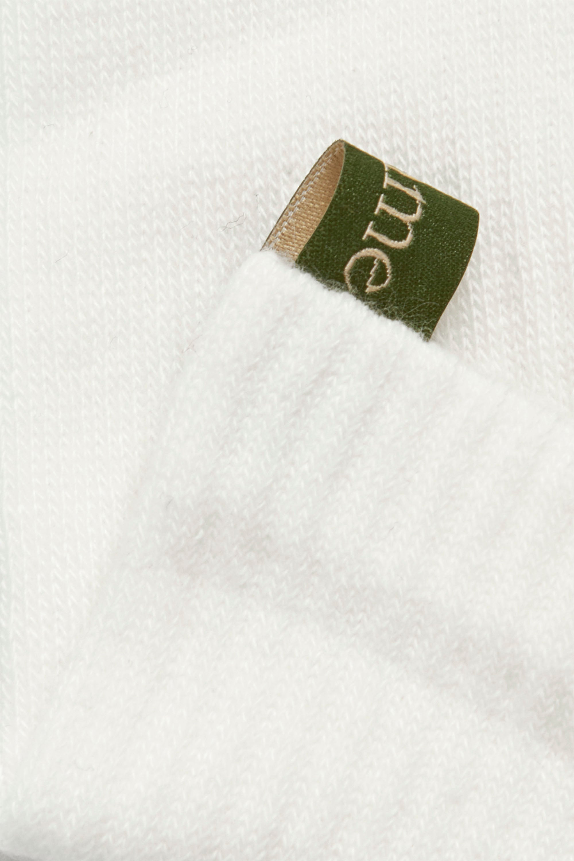Ribbon tag cuff detail of The Tube Sock, White with green tag, GOTS certified Organic Cotton, by Comme Si